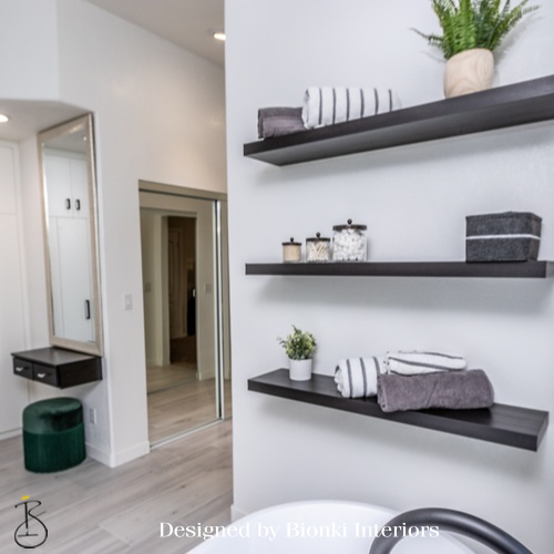 Custom interior design detail featuring floating shelving and layered accessories. Designed by Bionki Interiors.