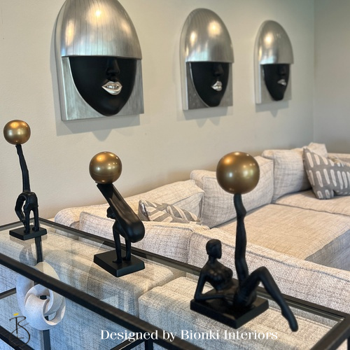 Custom interior design detail featuring sculptural accent lighting and curated decorative elements. Designed by Bionki Interiors.