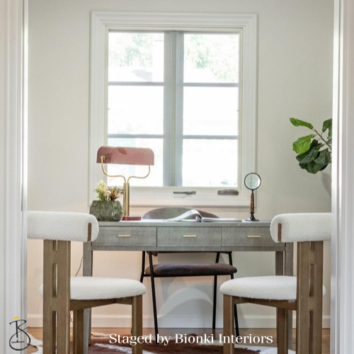 Luxury home office staging featuring a compact desk, sculptural lamp, and natural light. Staged by Bionki Interiors.