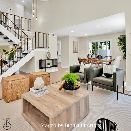 Luxury vacant home staging for a modern living room with clean-lined furniture, layered textures, and balanced proportions designed to help buyers visualize the space. Staged by Bionki Interiors.