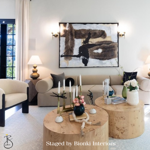 Luxury living room staging featuring sculptural seating and curated accessories. Staged by Bionki Interiors.